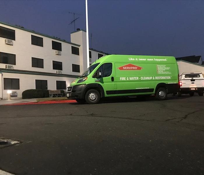 SERVPRO van parked outside of a building