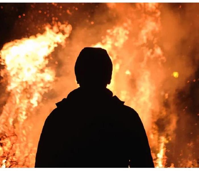 person looking at fire
